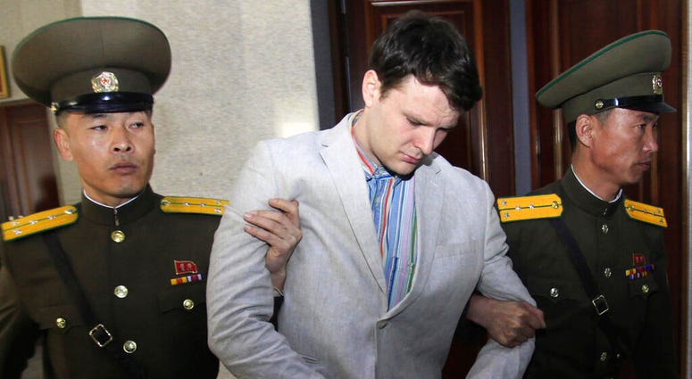 In this March 16, 2016, file photo, American student Otto Warmbier, center, is escorted at the Supreme Court in Pyongyang, North Korea. (AP Photo/Jon Chol Jin, File)