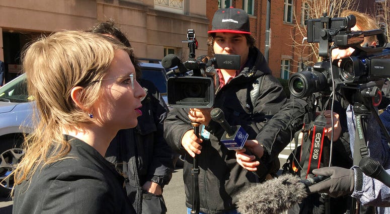 In this Tuesday, March 5, 2019 photo, Chelsea Manning addresses the media outside federal court in Alexandria, Va. (AP Photo/Matthew Barakat)