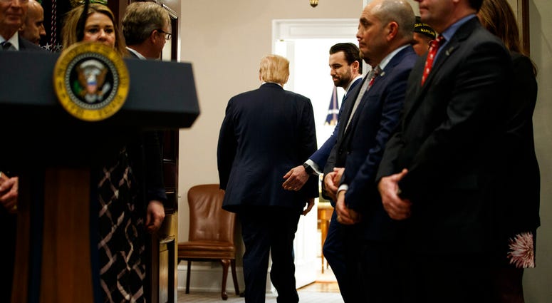 President Donald Trump departs after a signing ceremony for an executive order on a "National Roadmap to Empower Veterans and End Veteran Suicide," in the Roosevelt Room of the White House, Tuesday, March 5, 2019, in Washington. (AP Photo/ Evan Vucci)