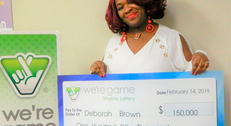 This Feb. 14, 2019 photo provided by Virginia Lottery shows Debrorah Brown holding up a check after winning the Pick 4 in Richmond, Va. (Virginia Lottery via AP) This Feb. 14, 2019 photo provided by Virginia Lottery shows Debrorah Brown holding up a check after winning the Pick 4 in Richmond, Va. (Virginia Lottery via AP)