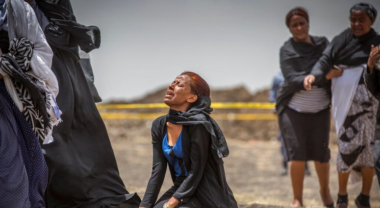 Relative grieving victim at Ethiopia crash site