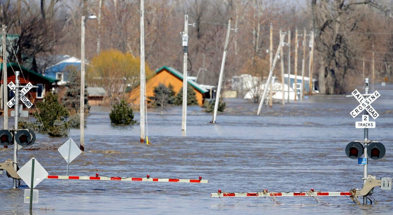 A railroad crossing is flooded with water from the Platte River, in Plattsmouth, Neb., Sunday, March 17, 2019. (AP Photo/Nati Harnik) A railroad crossing is flooded with water from the Platte River, in Plattsmouth, Neb., Sunday, March 17, 2019. (AP Photo/Nati Harnik)