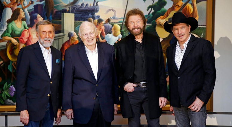 Ray Stevens, from left, Jerry Bradley, Ronnie Dunn, and Kix Brooks pose at a press conference announcing that they will be inducted into the Country Music Hall of Fame Monday, March 18, 2019, in Nashville, Tenn. (AP Photo/Mark Humphrey) Ray Stevens, from left, Jerry Bradley, Ronnie Dunn, and Kix Brooks pose at a press conference announcing that they will be inducted into the Country Music Hall of Fame Monday, March 18, 2019, in Nashville, Tenn. (AP Photo/Mark Humphrey)
