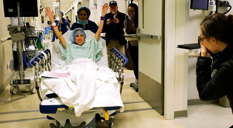 Nina Martinez of Atlanta is wheeled into a Baltimore operating room to become who is thought to be the world’s first kidney transplant living donor with HIV. (Johns Hopkins Medicine via AP) Nina Martinez of Atlanta is wheeled into a Baltimore operating room to become who is thought to be the world’s first kidney transplant living donor with HIV. (Johns Hopkins Medicine via AP)