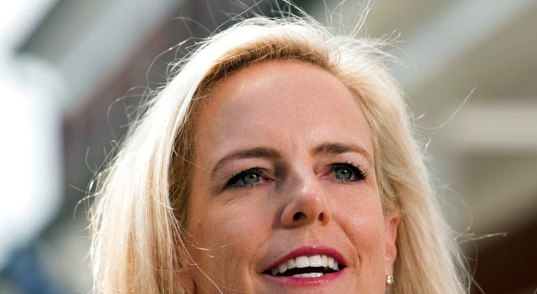 Homeland Security Secretary Kirstjen Nielsen talks outside her home in Alexandria, Va., on Thursday, April 8, 2019. (AP Photo/Kevin Wolf) Homeland Security Secretary Kirstjen Nielsen talks outside her home in Alexandria, Va., on Thursday, April 8, 2019. (AP Photo/Kevin Wolf)
