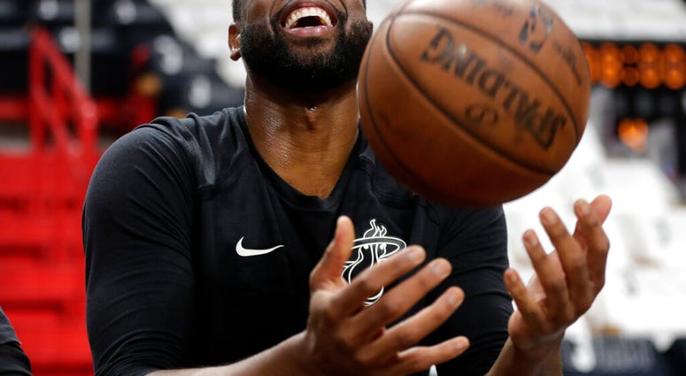 Miami Heat guard Dwyane Wade tosses a basketball before a game against the Philadelphia 76ers, Tuesday, April 9, 2019, in Miami. Wade is playing his final home regular season game before retiring at the end of the season.(AP Photo/Lynne Sladky) Miami Heat guard Dwyane Wade tosses a basketball before a game against the Philadelphia 76ers, Tuesday, April 9, 2019, in Miami. Wade is playing his final home regular season game before retiring at the end of the season.(AP Photo/Lynne Sladky)