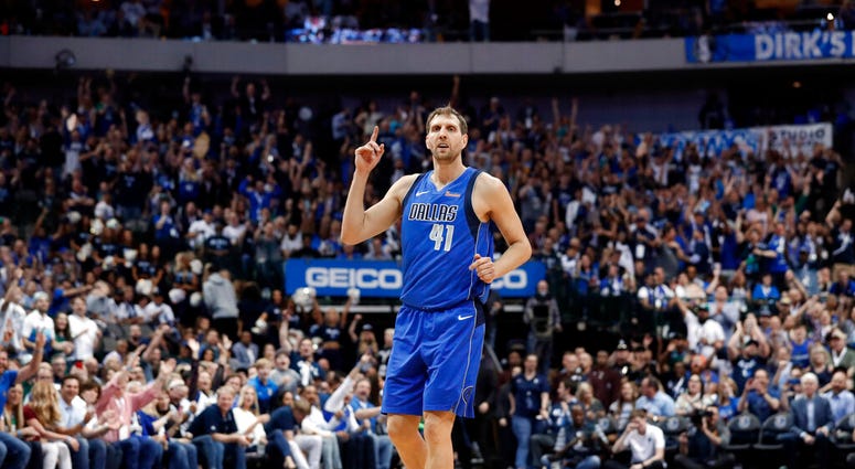 Dallas Mavericks' Dirk Nowitzki (41) celebrates sinking a 3-point basket during the second half of the team's NBA basketball game against the Phoenix Suns in Dallas, Tuesday, April 9, 2019. (AP Photo/Tony Gutierrez) Dallas Mavericks' Dirk Nowitzki (41) celebrates sinking a 3-point basket during the second half of the team's NBA basketball game against the Phoenix Suns in Dallas, Tuesday, April 9, 2019. (AP Photo/Tony Gutierrez)