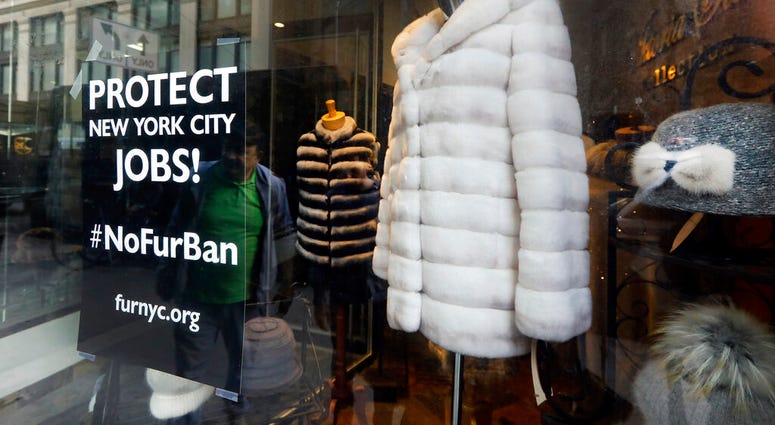 This April 10, 2019, photo shows a sign by furnyc.org in the window of Victoria Stass Collection in New York's fur district. (AP Photo/Richard Drew) This April 10, 2019, photo shows a sign by furnyc.org in the window of Victoria Stass Collection in New York's fur district. (AP Photo/Richard Drew)