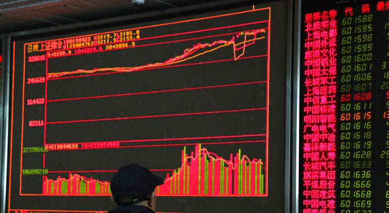 An investor monitors prices at a stock brokerage in Beijing on Tuesday, April 23, 2019. (AP Photo/Ng Han Guan) An investor monitors prices at a stock brokerage in Beijing on Tuesday, April 23, 2019. (AP Photo/Ng Han Guan)