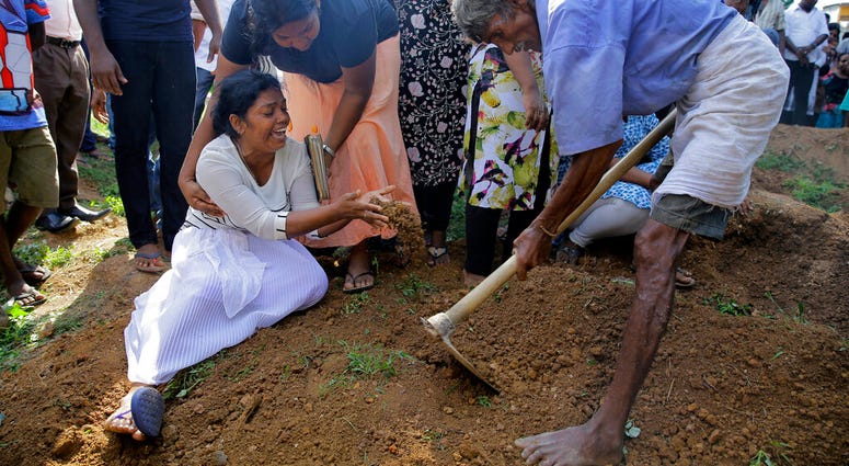 Relative mourning at the bural of victim of Sir Lanka attacks