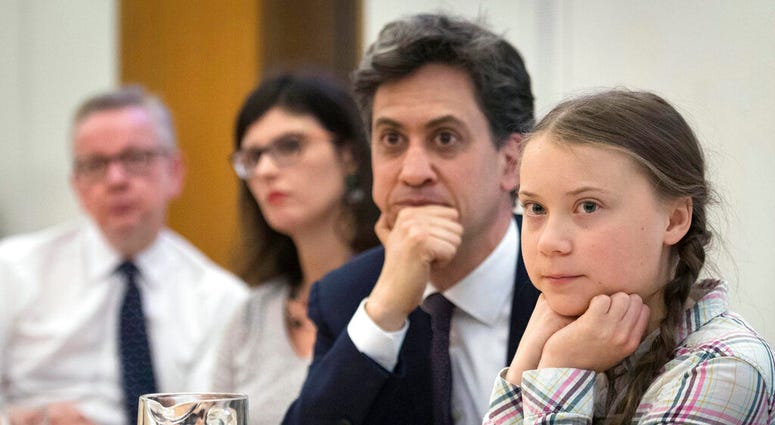 Environment Secretary Michael Gove, left, Former Labour leader Ed Miliband, second right, and Swedish climate activist Greta Thunberg, right, at the House of Commons in Westminster, London. (Stefan Rousseau/PA via AP) Environment Secretary Michael Gove, left, Former Labour leader Ed Miliband, second right, and Swedish climate activist Greta Thunberg, right, at the House of Commons in Westminster, London. (Stefan Rousseau/PA via AP)
