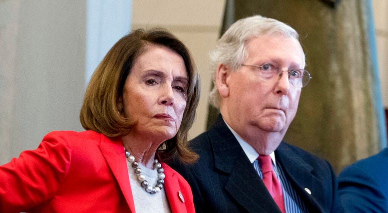March 21, 2018, file photo Nancy Pelosi of Calif., and Senate Majority Leader Mitch McConnell of Ky., March 21, 2018, file photo Nancy Pelosi of Calif., and Senate Majority Leader Mitch McConnell of Ky., attend a Congressional Gold Medal Ceremony