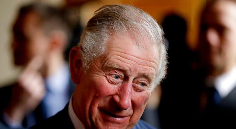 FILE _ In this Wednesday, Feb. 14, 2018 file photo, Britain's Prince Charles talks with delegates during a reception whilst attending a coral reef health and resilience meeting at Fishmongers Hall in London. (AP Photo/Matt Dunham, Pool, File) FILE _ In this Wednesday, Feb. 14, 2018 file photo, Britain's Prince Charles talks with delegates during a reception whilst attending a coral reef health and resilience meeting at Fishmongers Hall in London. (AP Photo/Matt Dunham, Pool, File)