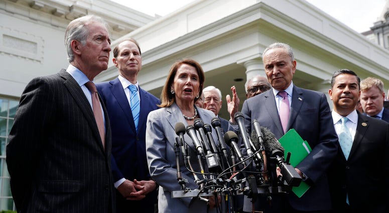 Speaker of the House Nancy Pelosi of Calif. and Senate Minority Leader Sen. Chuck Schumer of N.Y. and other Democrats, walk out to talk to the media after meeting with President Donald Trump. (AP Photo/Evan Vucci) Speaker of the House Nancy Pelosi of Calif. and Senate Minority Leader Sen. Chuck Schumer of N.Y. and other Democrats, walk out to talk to the media after meeting with President Donald Trump. (AP Photo/Evan Vucci)