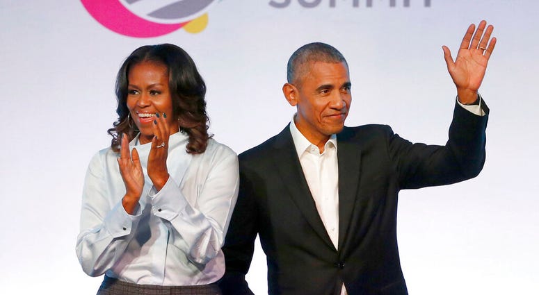 FILE - In this Oct. 31, 2017, file photo, former President Barack Obama, right, and former first lady Michelle Obama appear at the Obama Foundation Summit in Chicago. (AP Photo/Charles Rex Arbogast, File) FILE - In this Oct. 31, 2017, file photo, former President Barack Obama, right, and former first lady Michelle Obama appear at the Obama Foundation Summit in Chicago. (AP Photo/Charles Rex Arbogast, File)
