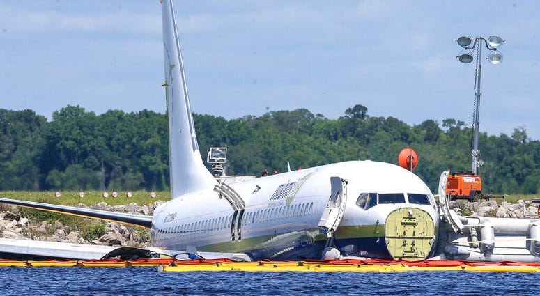 A charter plane carrying 143 people and traveling from Cuba to north Florida sits in a river at the end of a runway A charter plane carrying 143 people and traveling from Cuba to north Florida sits in a river at the end of a runway, Saturday, May 4, 2019
