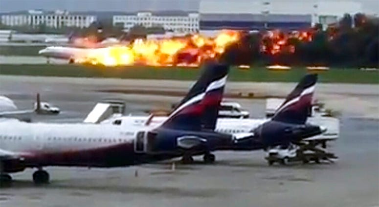 Russian plane on fire as it lands in Mosow
