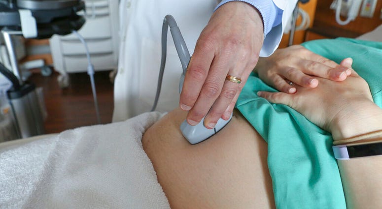 FILE - In this Aug. 7, 2018 file photo, a doctor performs an ultrasound scan on a pregnant woman at a hospital in Chicago. (AP Photo/Teresa Crawford) FILE - In this Aug. 7, 2018 file photo, a doctor performs an ultrasound scan on a pregnant woman at a hospital in Chicago. (AP Photo/Teresa Crawford)