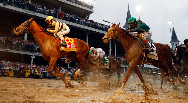 In this May 4, 2019, file photo, Flavien Prat rides Country House to the finish line during the 145th running of the Kentucky Derby horse race at Churchill Downs in Louisville, Ky. (AP Photo/Matt Slocum, File)