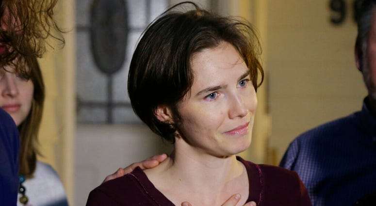 In this March 27, 2015 photo Amanda Knox talks to reporters outside her mother's home, in Seattle, WA, United States. (AP Photo/Ted S. Warren) In this March 27, 2015 photo Amanda Knox talks to reporters outside her mother's home, in Seattle, WA, United States. (AP Photo/Ted S. Warren)