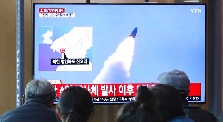 People in Seoul watching a TV showing North Korean missile launch