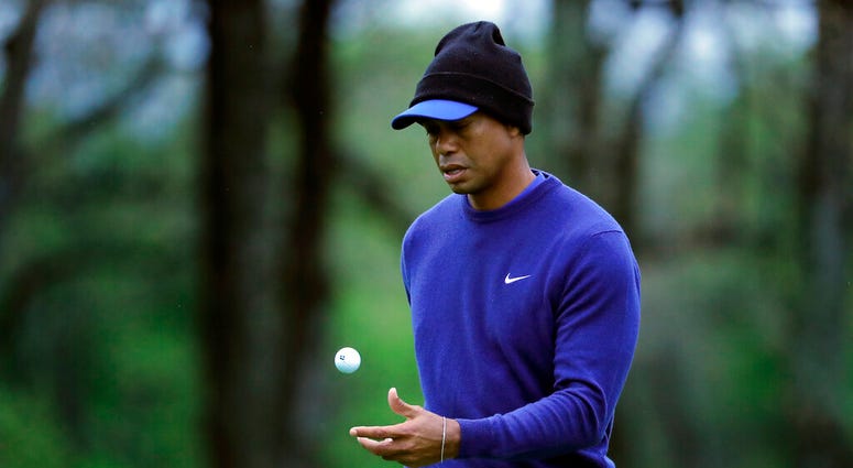 Tiger Woods flips his ball as he walks along the ninth green during a practice round for the PGA Championship golf tournament, Monday, May 13, 2019, in Farmingdale, N.Y. (AP Photo/Julie Jacobson) Tiger Woods flips his ball as he walks along the ninth green during a practice round for the PGA Championship golf tournament, Monday, May 13, 2019, in Farmingdale, N.Y. (AP Photo/Julie Jacobson)