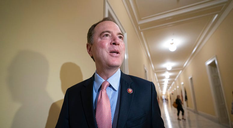 House Intelligence Committee Chairman Adam Schiff, D-Calif., responds to reporters as he arrives for an open hearing on China, at the Capitol in Washington, Thursday, May 16, 2019. (AP Photo/J. Scott Applewhite)