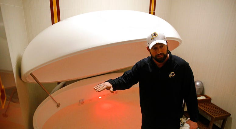 Washington Redskins head athletic trainer Larry Hess demonstrates a salt water float orb inside a recovery room at the team's NFL football training facility in Ashburn, Va. (AP Photo/Patrick Semansky) Washington Redskins head athletic trainer Larry Hess demonstrates a salt water float orb inside a recovery room at the team's NFL football training facility in Ashburn, Va. (AP Photo/Patrick Semansky)
