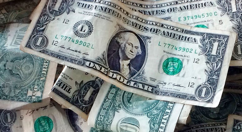 FILE - This Oct. 24, 2016, file photo shows dollar bills in New York. (AP Photo/Mark Lennihan, File) FILE - This Oct. 24, 2016, file photo shows dollar bills in New York. (AP Photo/Mark Lennihan, File)