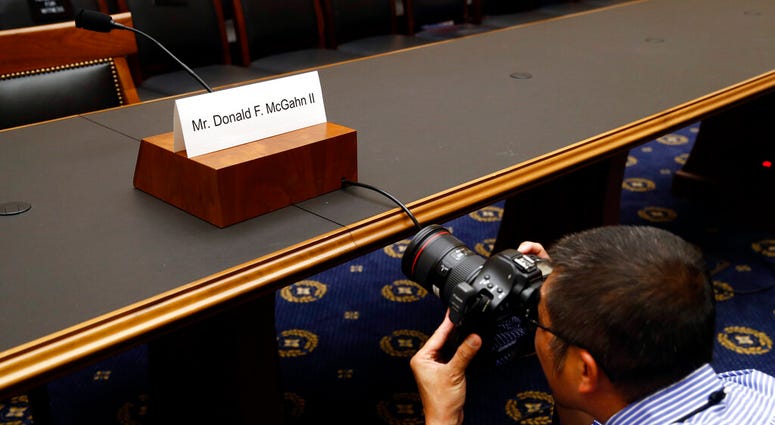 A photojournalist photographs a name placard for former White House Counsel Don McGahn, who is not expected to appear before a House Judiciary Committee hearing, Tuesday, May 21, 2019, on Capitol Hill in Washington. (AP Photo/Patrick Semansky) A photojournalist photographs a name placard for former White House Counsel Don McGahn, who is not expected to appear before a House Judiciary Committee hearing, Tuesday, May 21, 2019, on Capitol Hill in Washington. (AP Photo/Patrick Semansky)