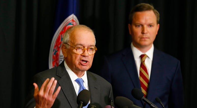 McGuire Woods law firm partner, Richard Cullen, left, gestures as Ben Hatch, right, listen during a news conference in Norfolk, Va., Wednesday, May 22, 2019. (AP Photo/Steve Helber)