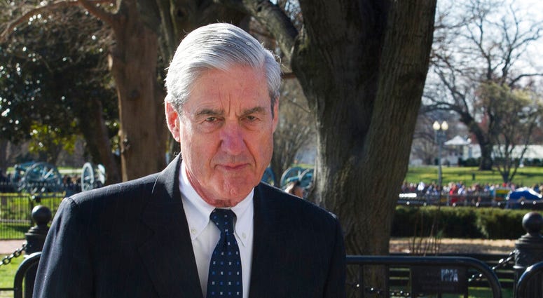 In this March 24, 2019 photo, Special Counsel Robert Mueller walks past the White House, after attending St. John's Episcopal Church for morning services, in Washington. (AP Photo/Cliff Owen, File)