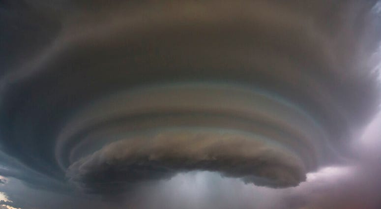 FILE - In this Tuesday, June, 26, 2018 file photo, a severe thunderstorm makes its way towards Wichita, Kan. Travis Heying, a photographer with The Wichita Eagle newspaper, captured the scene while he was chasing thunderstorms. He said that no tornadoes t