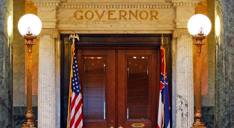 The title of governor rests above the entrance to the office at the Mississippi State Capitol in Jackson, Miss., Wednesday, May 29, 2019. (AP Photo/Rogelio V. Solis)