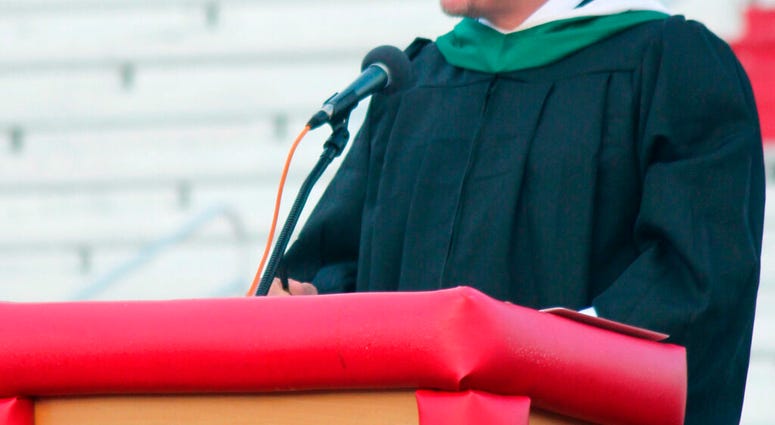 In this May 23, 2019 photo, Principal Kenny DeMoss gives closing remarks during Parkersburg High School's 2019 graduation ceremony, in Parkersburg, W.Va. The West Virginia principal accused of plagiarizing Ashton Kutcher in the address to his school's gra