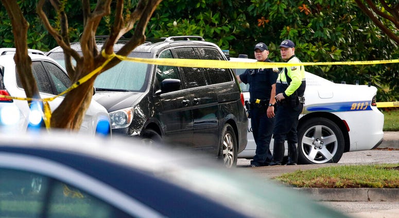 Law enforcement officials work outside a municipal building that was the scene of a shooting, Saturday, June 1, 2019, in Virginia Beach, Va. v(AP Photo/Patrick Semansky)