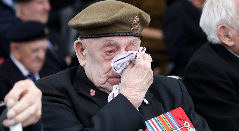 Veteran wipes his eyes during D-Day ceremony