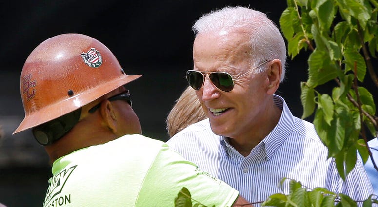 Joe Biden talking to a worker in Boston