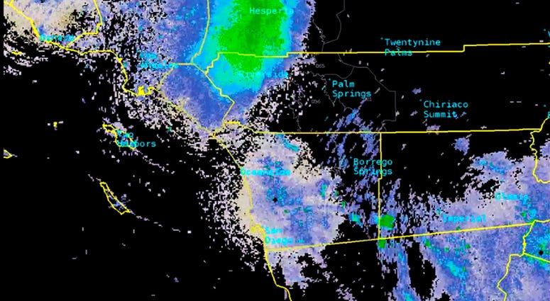This Tuesday, June 4, 2019, image provided by National Weather Service radar shows a green mark that indicates a massive swarm of ladybugs over Southern California. (National Weather Service via AP) This Tuesday, June 4, 2019, image provided by National Weather Service radar shows a green mark that indicates a massive swarm of ladybugs over Southern California. (National Weather Service via AP)