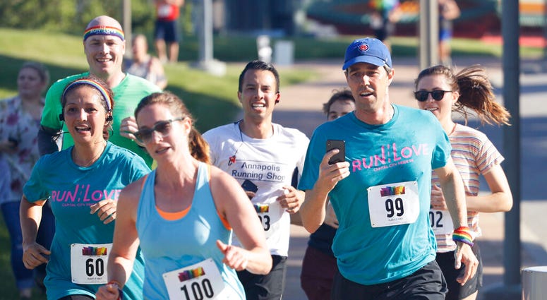 Democratic presidential candidate Beto O'Rourke, right, runs the Capital City Pride Fest Fun Run 5K with his wife Amy, left, Saturday, June 8, 2019, in Des Moines, Iowa. (AP Photo/Charlie Neibergall) Democratic presidential candidate Beto O'Rourke, right, runs the Capital City Pride Fest Fun Run 5K with his wife Amy, left, Saturday, June 8, 2019, in Des Moines, Iowa. (AP Photo/Charlie Neibergall)