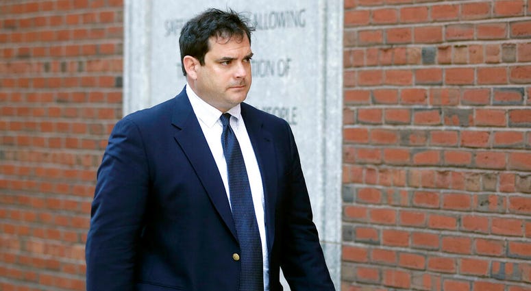 In this March 12, 2019 file photo, John Vandemoer, former head sailing coach at Stanford, arrives at federal court in Boston to plead guilty to charges in a nationwide college admissions bribery scandal. (AP Photo/Steven Senne, File)