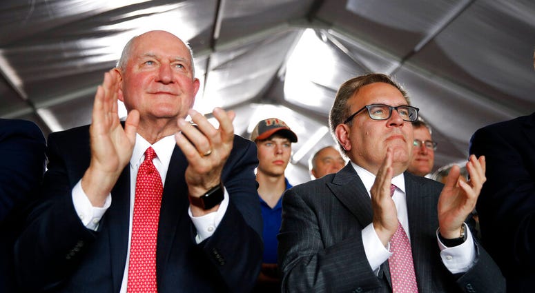 Agriculture Secretary Sonny Perdue, left, and Environmental Protection Agency Administrator Andrew Wheeler applaud as they listen to President Donald Trump speak. (AP Photo/Patrick Semansky) Agriculture Secretary Sonny Perdue, left, and Environmental Protection Agency Administrator Andrew Wheeler applaud as they listen to President Donald Trump speak. (AP Photo/Patrick Semansky)