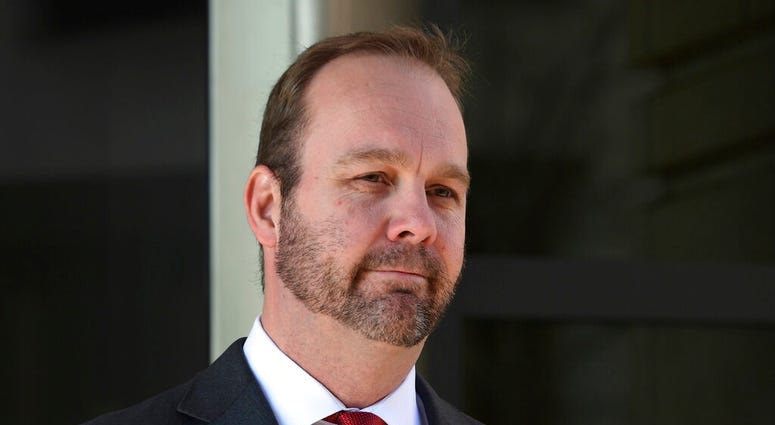 FILE - In this Dec. 11, 2017, file photo, Rick Gates, departs federal court in Washington. House intelligence committee has issued subpoenas for former national security adviser Michael Flynn and Rick Gates, a former Trump campaign aide. (AP Photo/Susan W
