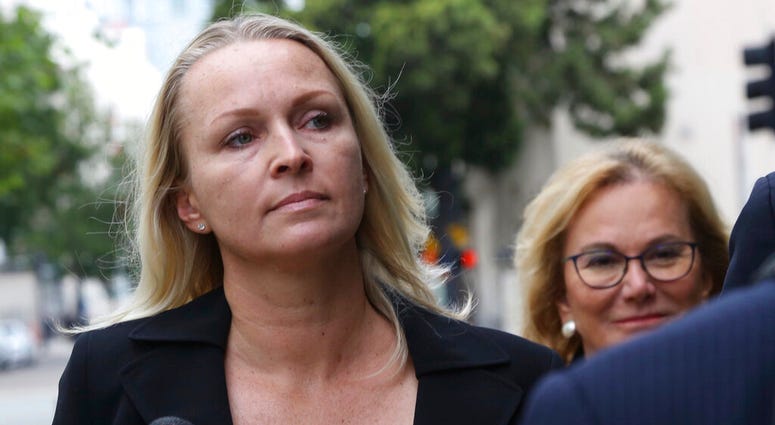 Margaret Hunter, left, wife of indicted Republican U.S. Rep. Duncan Hunter, arrives at federal courthouse in downtown San Diego on Thursday, June 13, 2019. Hunter, who had previously pleaded not guilty to correction charges, withdrew that plea in U.S. cou