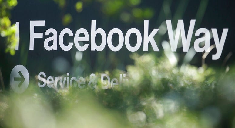 FILE - In this April 25, 2019, file photo an address sign for Facebook Way is shown in Menlo Park, Calif. Facebook unveiled a broad plan Tuesday, June 18, to create a new digital currency. (AP Photo/Jeff Chiu, File) FILE - In this April 25, 2019, file photo an address sign for Facebook Way is shown in Menlo Park, Calif. Facebook unveiled a broad plan Tuesday, June 18, to create a new digital currency. (AP Photo/Jeff Chiu, File)