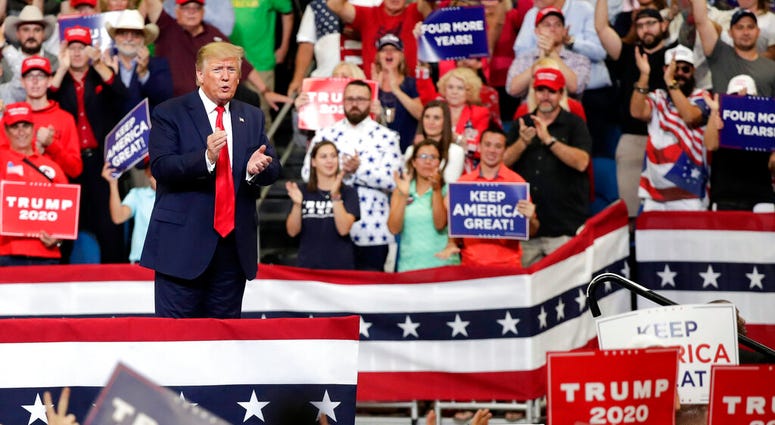 President Trump and supporters at Orlando campaign rally