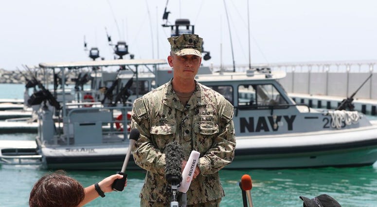 Commander Sean Kido talking to reporters