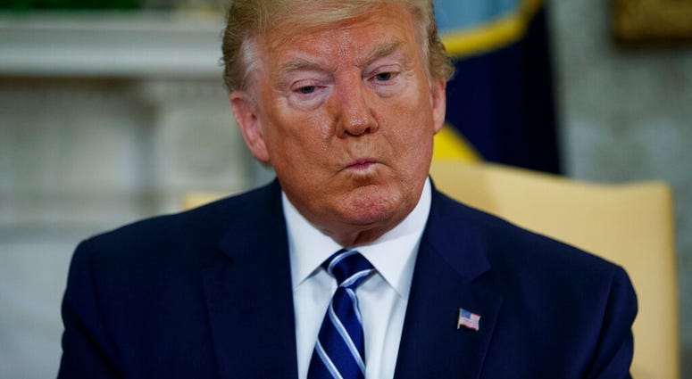 President Donald Trump listens to a question during a meeting with Canadian Prime Minister Justin Trudeau in the Oval Office of the White House, Thursday, June 20, 2019, in Washington. (AP Photo/Evan Vucci)