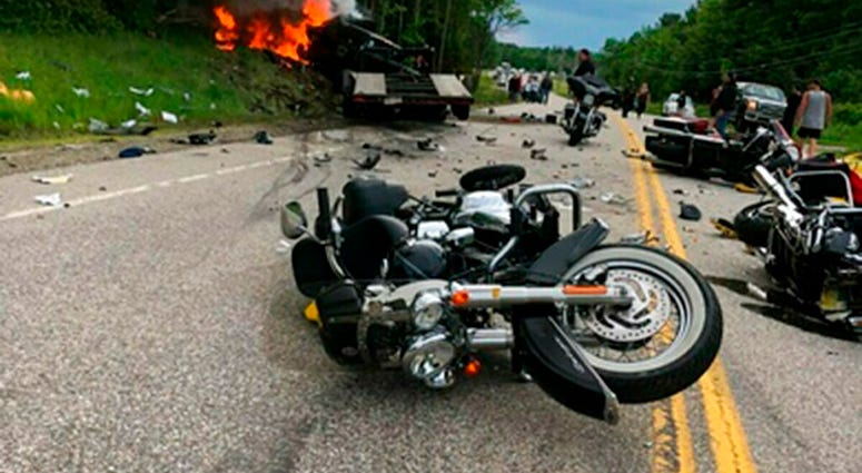 This photo provided by Miranda Thompson shows the scene where several motorcycles and a pickup truck collided on a rural, two-lane highway Friday, June 21, 2019 in Randolph, N.H. New Hampshire State Police said a 2016 Dodge 2500 pickup truck collided with