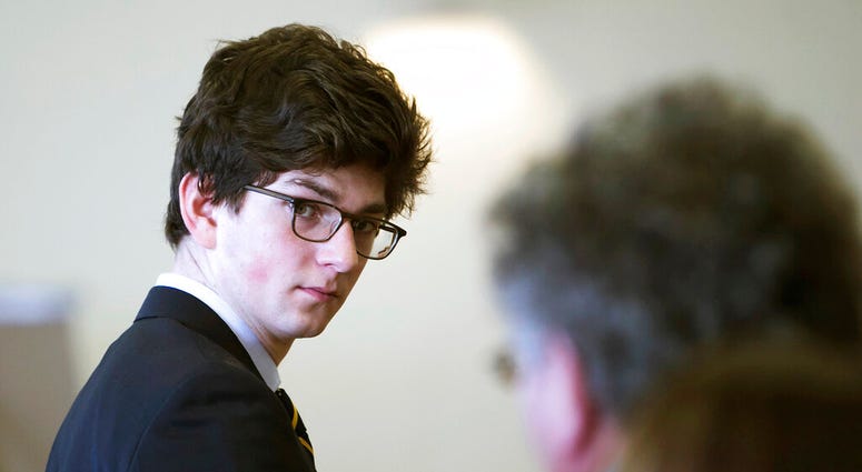 FILE - In this Feb. 21, 2017, file photo, Owen Labrie looks at his family during a break on the first day of a hearing in Concord, N.H., on whether he deserves a new trial. Labrie, a New Hampshire prep school graduate convicted of sexually assaulting a 15